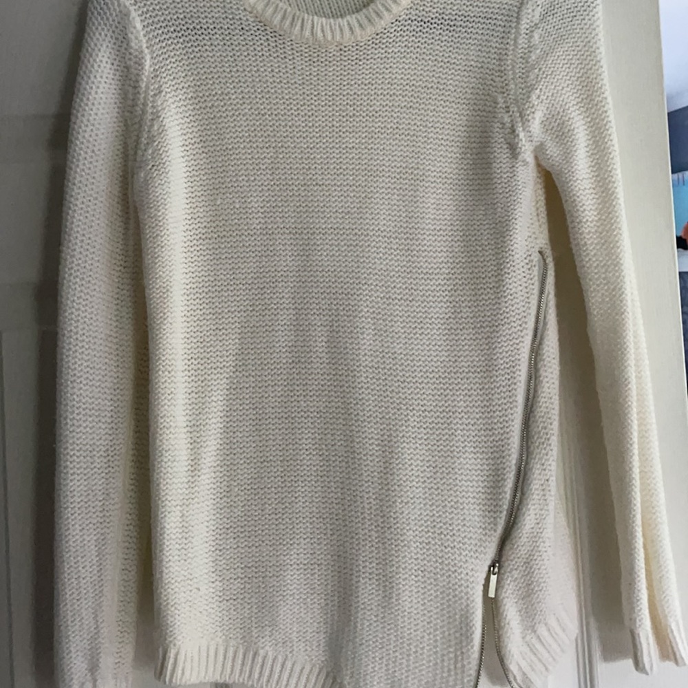 white sweater with silver zipper